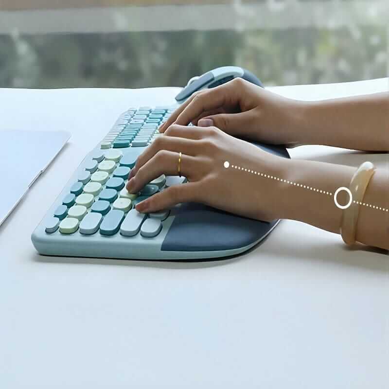 Woman typing with her hands comfortably placed against wrist support