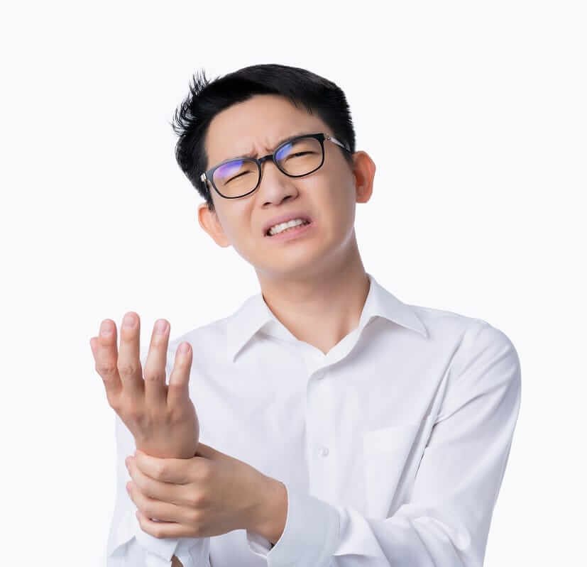 Asian Man grabbing his wrist in pain