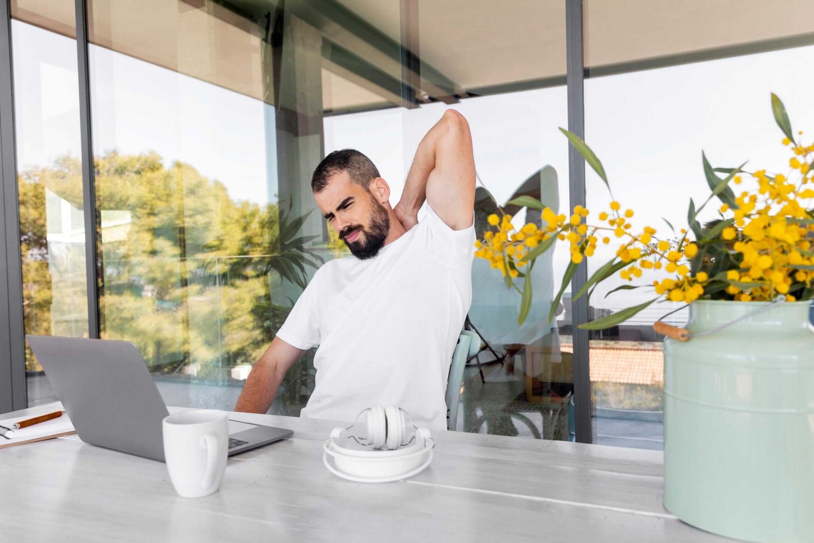 Man stretching at his work station